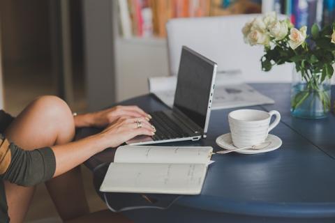 Woman typing on laptop