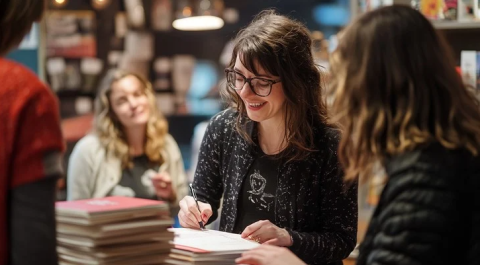 author signing a book