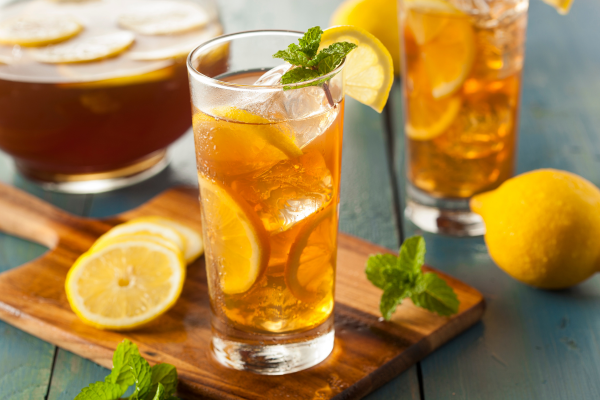 Homemade iced tea with lemons and mint.