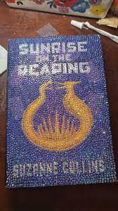 bedazzled cover of Sunrise on the Reaping by Suzanne Collins